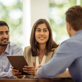 men and woman in a meeting
