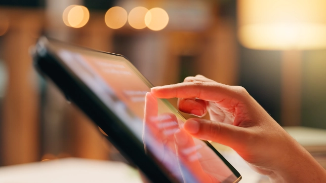 Hand touching tablet