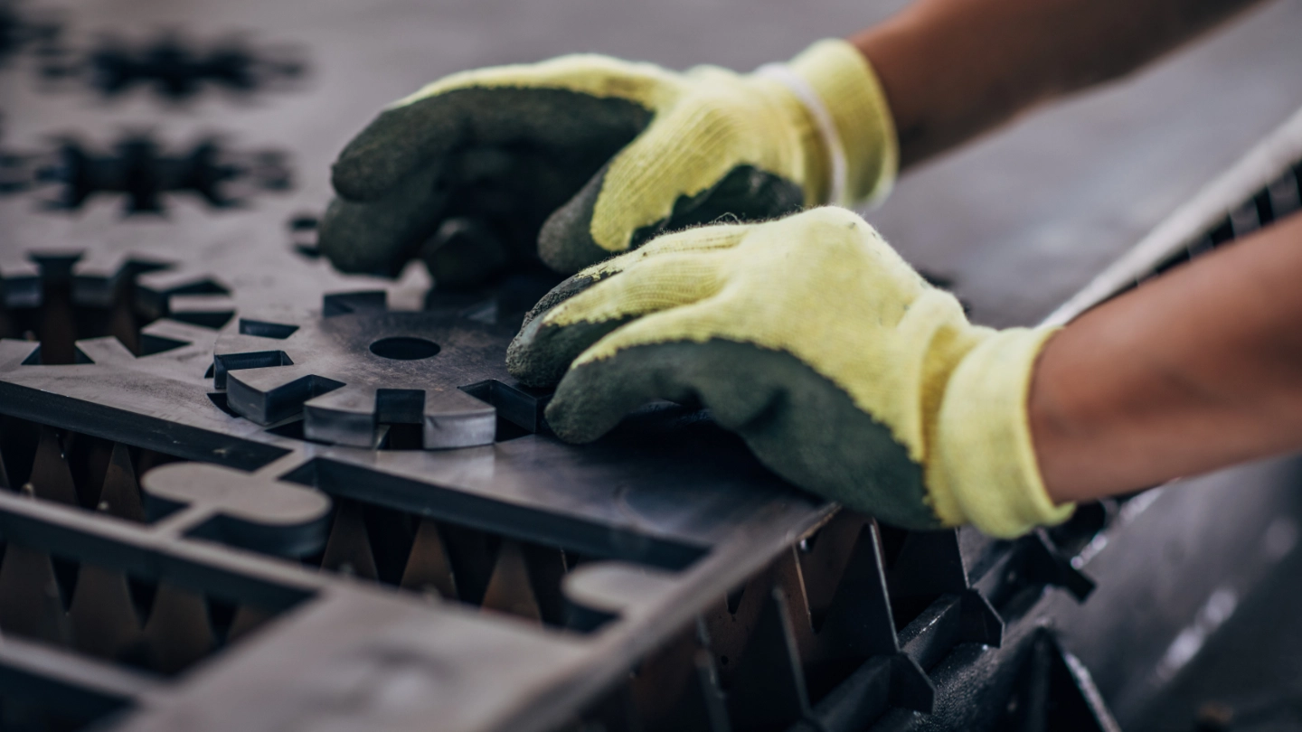 Close up of an engineer forming a metal component image