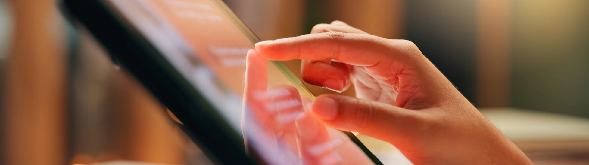 Hand touching tablet