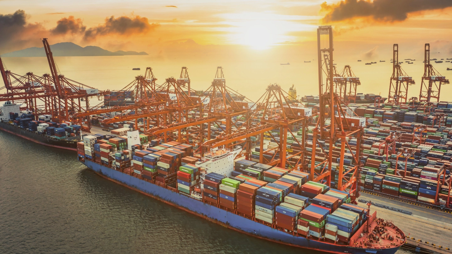 Aerial view of large ship in dock with containers Aerial view of large ship in dock